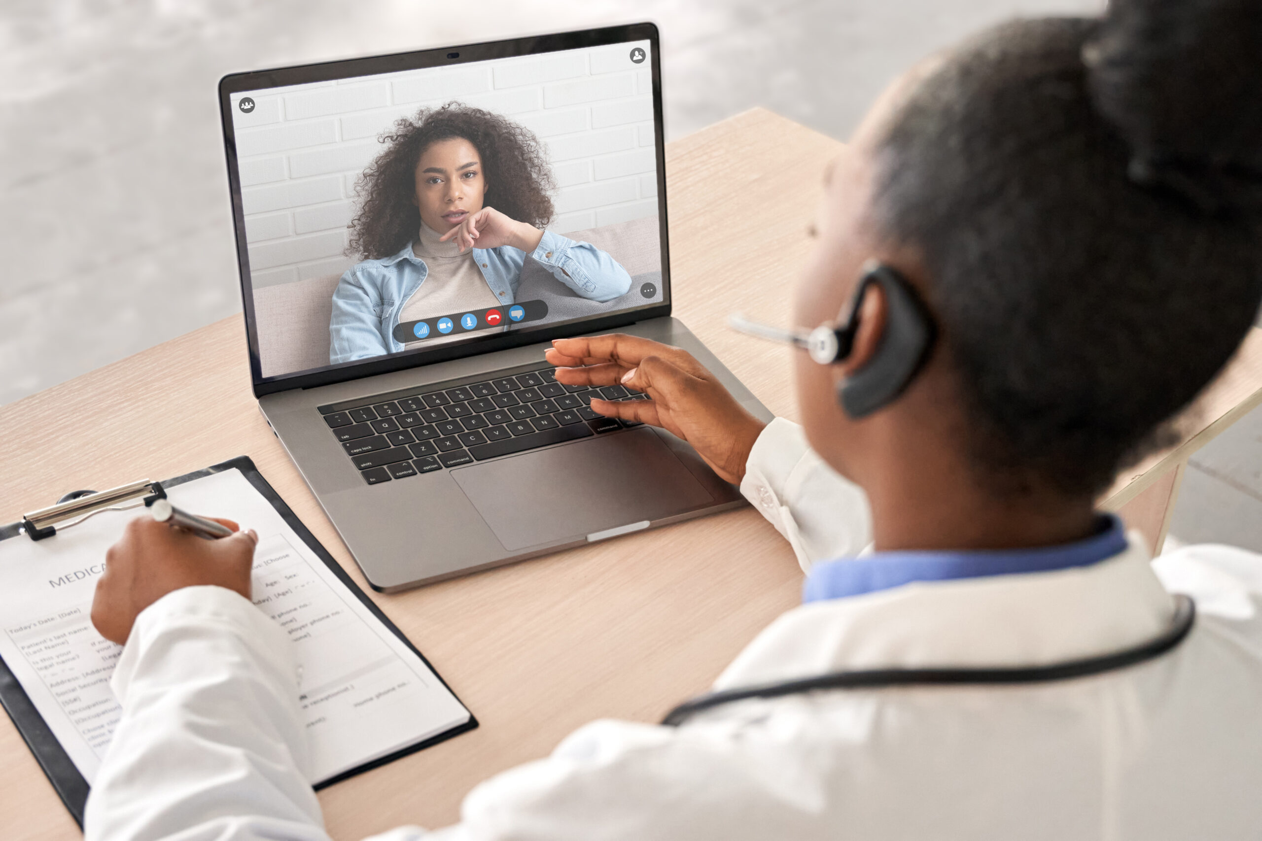 Doctor providing telehealth therapy to a patient.